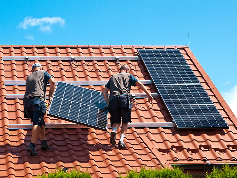 Installing solar panels on house roof